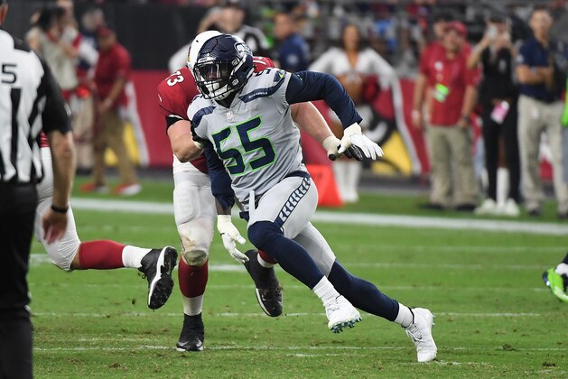 GLENDALE, AZ - SEPTEMBER 30:  Frank Clark #55 of the Seattle Seahawks rushes around John Wetzel #73 of the Arizona Cardinals at State Farm Stadium on September 30, 2018 in Glendale, Arizona.  (Photo by Norm Hall/Getty Images)