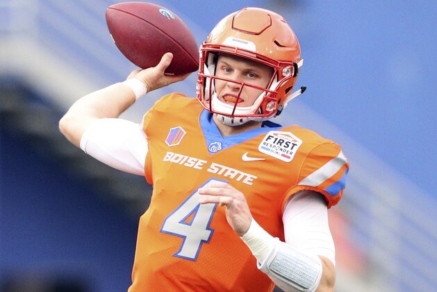 Boise State quarterback Brett Rypien (4) warms up before the First Responder Bowl NCAA football game against Boston College Wednesday, Dec. 26, 2018, in Dallas. (AP Photo/Richard W. Rodriguez)