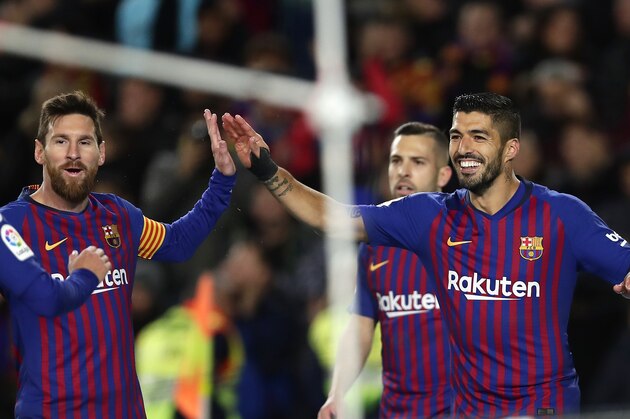 FC Barcelona's Luis Suarez, right, celebrates after scoring his opening goal with his teammate Lionel Messi during the Spanish La Liga soccer match between FC Barcelona and Eibar at the Camp Nou stadium in Barcelona, Spain, Sunday, Jan. 13, 2019. (AP Photo/Manu Fernandez)