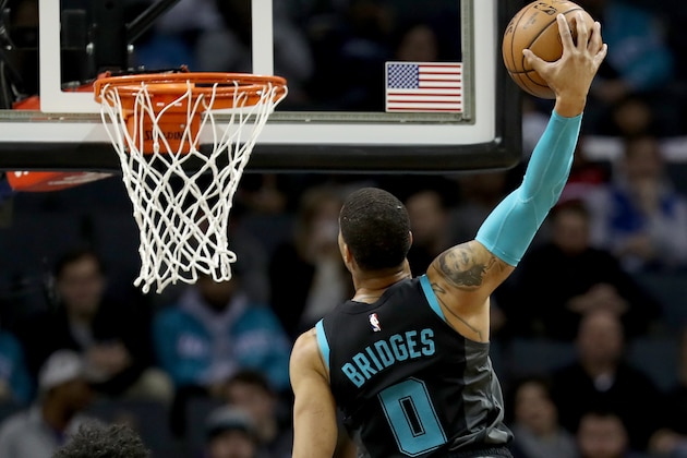 CHARLOTTE, NORTH CAROLINA - JANUARY 17: Harry Giles #20 of the Sacramento Kings watches as Miles Bridges #0 of the Charlotte Hornets dunks the ball during their game at Spectrum Center on January 17, 2019 in Charlotte, North Carolina. NOTE TO USER: User expressly acknowledges and agrees that, by downloading and or using this photograph, User is consenting to the terms and conditions of the Getty Images License Agreement. (Photo by Streeter Lecka/Getty Images)