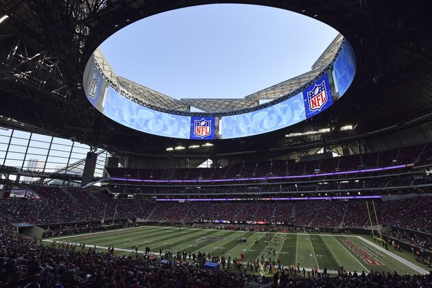 In this Sunday, Dec. 2, 2018, photo, the Atlanta Falcons play the Baltimore Ravens in the Mercedes-Benz stadium during the second half of an NFL football game, in Atlanta. Atlanta leaders, police and federal officials plan to discuss public safety plans ahead of Super Bowl 53. (AP Photo/Danny Karnik)