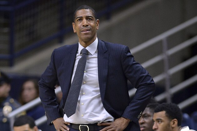 FILE - In this Feb. 7, 2018, file photo, Connecticut head coach Kevin Ollie watches from the sideline during the first half an NCAA college basketball game in Storrs, Conn. Ollie was fired in March amid an NCAA investigation. In response to open records requests from The Associated Press and other news organizations, UConn president Susan Herbst on Monday, June 25, released a June 19 letter upholding Ollie's firing, which said the former men's basketball coach had a pattern of breaking NCAA rules and committed serious violations. (AP Photo/Jessica Hill, File)