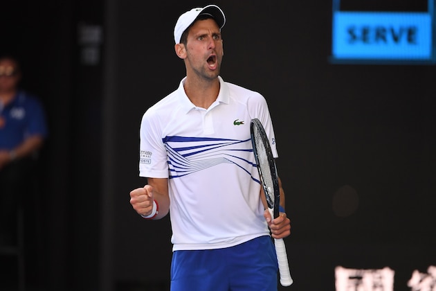 Serbia's Novak Djokovic reacts after a point against Canada's Denis Shapovalov during their men's singles match on day six of the Australian Open tennis tournament in Melbourne on January 19, 2019. (Photo by WILLIAM WEST / AFP) / -- IMAGE RESTRICTED TO EDITORIAL USE - STRICTLY NO COMMERCIAL USE --        (Photo credit should read WILLIAM WEST/AFP/Getty Images)