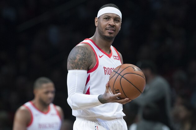 FILE - In this Nov. 2, 2018, file photo, Houston Rockets forward Carmelo Anthony reacts during the second half of the team's NBA basketball game against the Brooklyn Nets in New York. The Rockets won 119-111. The addition of Anthony to the Rockets’ roster produced more thorns than fruit and now he is out. (AP Photo/Mary Altaffer, File)