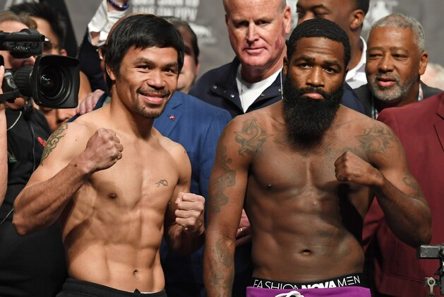 LAS VEGAS, NEVADA - JANUARY 18:  WBA welterweight champion Manny Pacquiao (L) and Adrien Broner pose during their official weigh-in at MGM Grand Garden Arena on January 18, 2019 in Las Vegas, Nevada. Pacquiao will defend his title against Broner on January 19 at MGM Grand Garden Arena in Las Vegas.  (Photo by Ethan Miller/Getty Images)