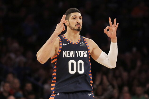 New York Knicks' Enes Kanter reacts after scoring during the first half of the NBA basketball game against the Milwaukee Bucks, Tuesday, Dec. 25, 2018, in New York. (AP Photo/Seth Wenig)