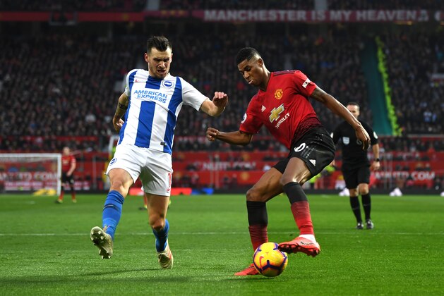 MANCHESTER, ENGLAND - JANUARY 19:  Marcus Rashford of Manchester United controls the ball under pressure from Pascal Gross of Brighton and Hove Albion before scoring his team's second goal during the Premier League match between Manchester United and Brighton & Hove Albion at Old Trafford on January 19, 2019 in Manchester, United Kingdom.  (Photo by Gareth Copley/Getty Images)