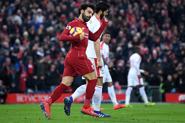 LIVERPOOL, ENGLAND - JANUARY 19:  Mohamed Salah of Liverpool celebrates after scoring his sides first goal during the Premier League match between Liverpool FC and Crystal Palace at Anfield on January 19, 2019 in Liverpool, United Kingdom.  (Photo by Laurence Griffiths/Getty Images)
