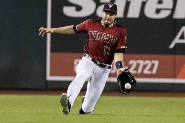 Arizona Diamondbacks centerfielder A.J. Pollock slides in the first inning to come up with the ball during a baseball game against the Colorado Rockies, Sunday, Sept 23, 2018, in Phoenix. (AP Photo/Darryl Webb)