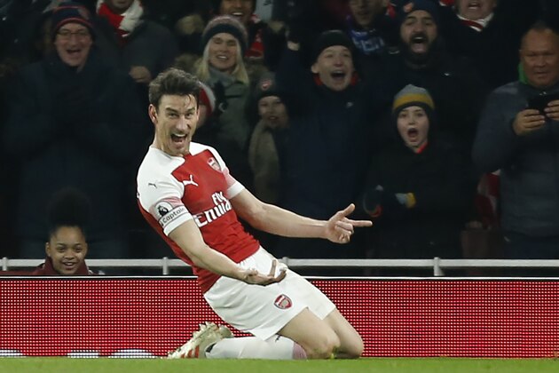 Arsenal's French defender Laurent Koscielny celebrates after scoring their second goal during the English Premier League football match between Arsenal and Cheslea at the Emirates Stadium in London on January 19, 2019. (Photo by Ian KINGTON / IKIMAGES / AFP) / RESTRICTED TO EDITORIAL USE. No use with unauthorized audio, video, data, fixture lists, club/league logos or 'live' services. Online in-match use limited to 45 images, no video emulation. No use in betting, games or single club/league/player publications.        (Photo credit should read IAN KINGTON/AFP/Getty Images)
