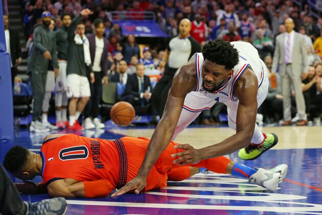PHILADELPHIA, PA - JANUARY 19: Joel Embiid #21 of the Philadelphia 76ers fouls Russell Westbrook #0 of the Oklahoma City Thunder during the second half of a game at Wells Fargo Center on January 19, 2019 in Philadelphia, Pennsylvania. The Thunder defeated the Sixers 117-115. (Photo by Rich Schultz/Getty Images)