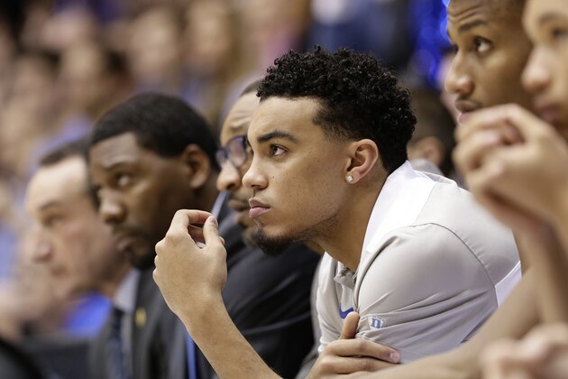 Duke's Tre Jones watches from the sidelines during the second half of an NCAA college basketball game against Virginia in Durham, N.C., Saturday, Jan. 19, 2019. Duke won 72-70. Jones is recovering from an injury. (AP Photo/Gerry Broome)