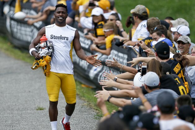 Pittsburgh Steelers wide receiver Antonio Brown is greeted by fans as he takes to the practice field during NFL football training camp in Latrobe, Pa., Thursday, July 26, 2018. (AP Photo/Keith Srakocic)