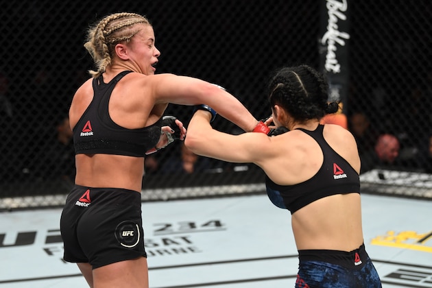 NEW YORK, NY - JANUARY 19:  (L-R) Paige VanZant punches Rachael Ostovich in their women's flyweight bout during the UFC Fight Night event at the Barclays Center on January 19, 2019 in the Brooklyn borough of New York City. (Photo by Josh Hedges/Zuffa LLC/Zuffa LLC via Getty Images)