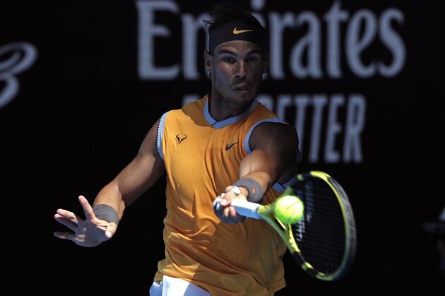Spain's Rafael Nadal makes a forehand return toTomas Berdych of the Czech Republic during their fourth round match at the Australian Open tennis championships in Melbourne, Australia, Sunday, Jan. 20, 2019. (AP Photo/Aaron Favila)