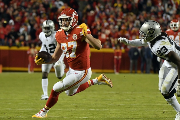 Kansas City Chiefs tight end Travis Kelce (87) carries the ball during the second half of an NFL football game against the Oakland Raiders in Kansas City, Mo., Sunday, Dec. 30, 2018. Travis Kelce surpassed Rob Gronkowski for the most receiving yards by a tight end in a single season in NFL history. (AP Photo/Ed Zurga)