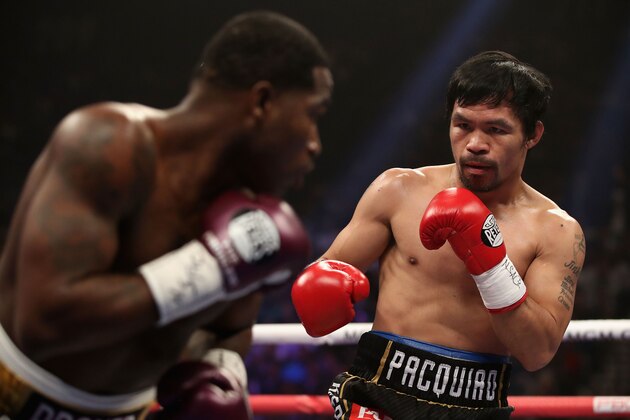 LAS VEGAS, NEVADA - JANUARY 19:  Manny Pacquiao (R) squares up with Adrien Broner during the WBA welterweight championship at MGM Grand Garden Arena on January 19, 2019 in Las Vegas, Nevada. (Photo by Christian Petersen/Getty Images)