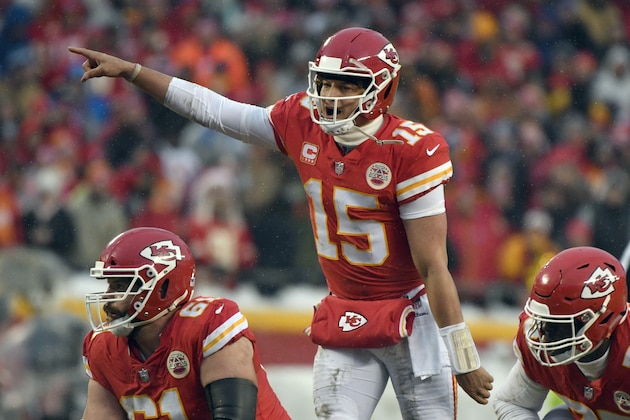 FILE - In this Jan. 12, 2019, file photo, Kansas City Chiefs quarterback Patrick Mahomes (15) calls a play at the line of scrimmage during the first half of the team's NFL divisional football playoff game against the Indianapolis Colts in Kansas City, Mo. The popular, record-setting quarterback shattered just about every franchise passing record in his first season as a starter, and his down-home style has made him a fan-favorite. The Chiefs play the New England Patriots on Sunday for the AFC championship. (AP Photo/Ed Zurga, File)