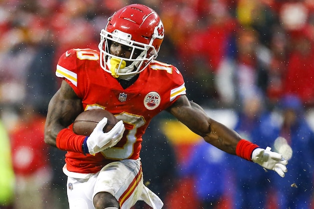 KANSAS CITY, MO - JANUARY 12: Wide receiver Tyreek Hill #10 of the Kansas City Chiefs runs after a pass catch against the Indianapolis Colts in the AFC Divisional Playoff at Arrowhead Stadium on January 12, 2019 in Kansas City, Missouri. (Photo by David Eulitt/Getty Images)