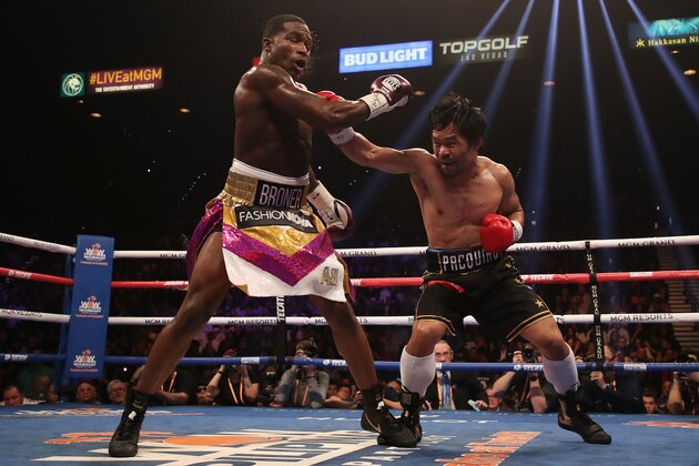 LAS VEGAS, NEVADA - JANUARY 19:  Manny Pacquiao (R) throws a right on Adrien Broner during the WBA welterweight championship at MGM Grand Garden Arena on January 19, 2019 in Las Vegas, Nevada. (Photo by Christian Petersen/Getty Images)