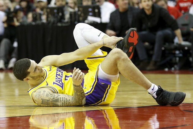 HOUSTON, TX - JANUARY 19:  Lonzo Ball #2 of the Los Angeles Lakers lays on the court after an injury in the second half against the Houston Rockets at Toyota Center on January 19, 2019 in Houston, Texas.  NOTE TO USER: User expressly acknowledges and agrees that, by downloading and or using this Photograph, user is consenting to the terms and conditions of the Getty Images License Agreement.  (Photo by Tim Warner/Getty Images)