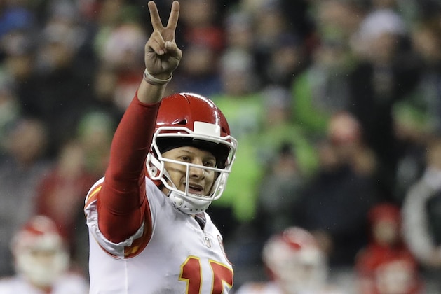 Kansas City Chiefs quarterback Patrick Mahomes signals the 2-point conversion attempt during the second half of an NFL football game against the Seattle Seahawks, Sunday, Dec. 23, 2018, in Seattle. The Chiefs scored on the play. (AP Photo/Elaine Thompson)