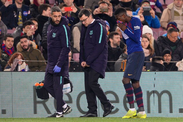 Barcelona's French forward Ousmane Dembele (R) leaves the pitch after sustaining an injury during the Spanish League football match between Barcelona and Leganes at the Camp Nou stadium in Barcelona on January 20, 2019. (Photo by Josep LAGO / AFP)        (Photo credit should read JOSEP LAGO/AFP/Getty Images)