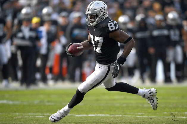 OAKLAND, CA - DECEMBER 09:  Jared Cook #87 of the Oakland Raiders runs with the ball after catching a pass against the Pittsburgh Steelers during the first half of an NFL football game at Oakland-Alameda County Coliseum on December 9, 2018 in Oakland, California.  (Photo by Thearon W. Henderson/Getty Images)