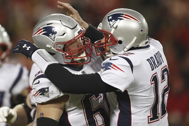 New England Patriots quarterback Tom Brady celebrates with center David Andrews (60) after throwing a touchdown pass to wide receiver Phillip Dorsett during the first half of the AFC Championship NFL football game against the Kansas City Chiefs, Sunday, Jan. 20, 2019, in Kansas City, Mo. (AP Photo/Jeff Roberson)