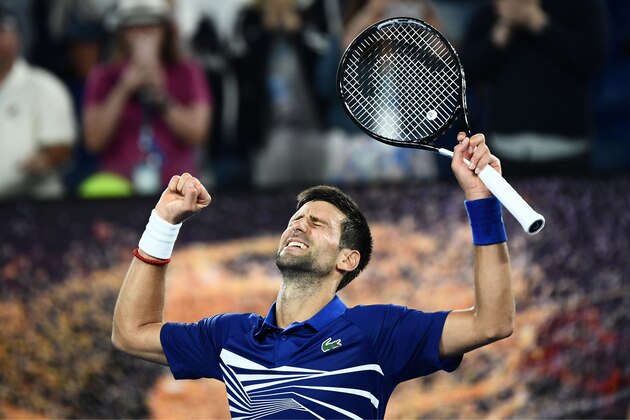 Serbia's Novak Djokovic celebrates his victory against Russia's Daniil Medvedev during their men's singles match on day eight of the Australian Open tennis tournament in Melbourne early on January 22, 2019. (Photo by Jewel SAMAD / AFP) / -- IMAGE RESTRICTED TO EDITORIAL USE - STRICTLY NO COMMERCIAL USE --        (Photo credit should read JEWEL SAMAD/AFP/Getty Images)
