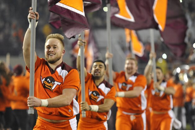 BLACKSBURG, VA - OCTOBER 28: Members of the Virginia Tech Hokies cheerleading squad carry flags onto the field prior to the game against the Duke Blue Devils at Lane Stadium on October 28, 2017 in Blacksburg, Virginia. (Photo by Michael Shroyer/Getty Images)