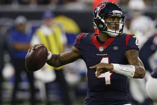 HOUSTON, TEXAS - JANUARY 05: Deshaun Watson #4 of the Houston Texans looks for a receiver against the Indianapolis Colts during the Wild Card Round at NRG Stadium on January 05, 2019 in Houston, Texas. (Photo by Bob Levey/Getty Images)