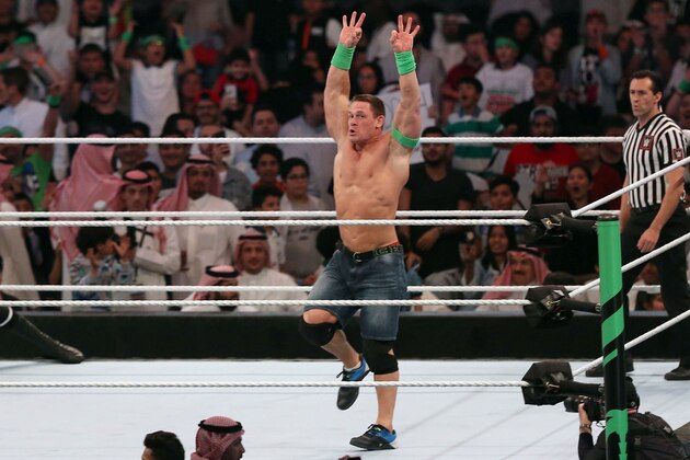 John Cena (R) competes with Triple H (L) during the World Wrestling Entertainment (WWE) Greatest Royal Rumble event in the Saudi coastal city of Jeddah on April 27, 2018. (Photo by STRINGER / AFP)        (Photo credit should read STRINGER/AFP/Getty Images)