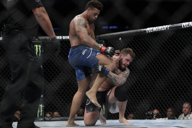 Greg Hardy knee's Allen Crowder to the head during the second round of a heavyweight mixed martial arts bout at UFC Fight Night Sunday, Jan. 20, 2019, in New York. Crowder won the fight after Hardy was disqualified for an illegal knee in the second round. (AP Photo/Frank Franklin II)