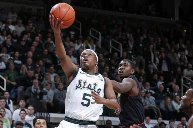 Michigan State's Cassius Winston, left, goes up for a layup against Maryland's Darryl Morsell during the first half of an NCAA college basketball game, Monday, Jan. 21, 2019, in East Lansing, Mich. (AP Photo/Al Goldis) Michigan State's Cassius Winston, left, goes up for a layup against Maryland's Darryl Morsell during the first half of an NCAA college basketball game, Monday, Jan. 21, 2019, in East Lansing, Mich. (AP Photo/Al Goldis)
