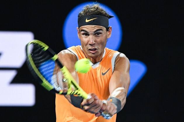 Spain's Rafael Nadal hits a return against Frances Tiafoe of the US during their men's singles quarter-final match on day nine of the Australian Open tennis tournament in Melbourne on January 22, 2019. (Photo by William WEST / AFP) / -- IMAGE RESTRICTED TO EDITORIAL USE - STRICTLY NO COMMERCIAL USE --        (Photo credit should read WILLIAM WEST/AFP/Getty Images)