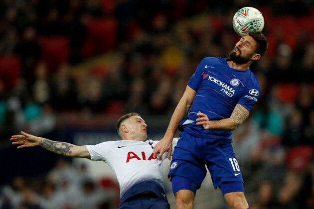 Tottenham Hotspur's English defender Kieran Trippier (L) vies to header the ball with Chelsea's French striker Olivier Giroud during the English League Cup semi-final first-leg football match between Tottenham Hotspur and Chelsea at Wembley Stadium in London, on January 8, 2019. - Tottenham won the first-leg 1-0. (Photo by Adrian DENNIS / AFP) / RESTRICTED TO EDITORIAL USE. No use with unauthorized audio, video, data, fixture lists, club/league logos or 'live' services. Online in-match use limited to 120 images. An additional 40 images may be used in extra time. No video emulation. Social media in-match use limited to 120 images. An additional 40 images may be used in extra time. No use in betting publications, games or single club/league/player publications. /         (Photo credit should read ADRIAN DENNIS/AFP/Getty Images)