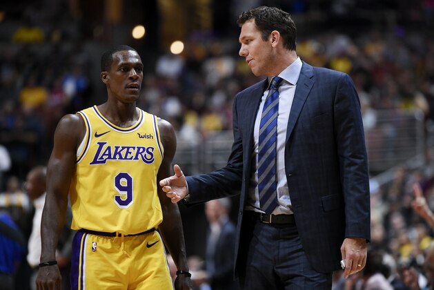 Los Angeles Lakers head coach Luke Walton, right, speaks with guard Rajon Rondo during the second half of an NBA preseason basketball game against the Los Angeles Clippers in Anaheim, Calif., Saturday, Oct. 6, 2018. The Clippers won 103-87. (AP Photo/Kelvin Kuo)