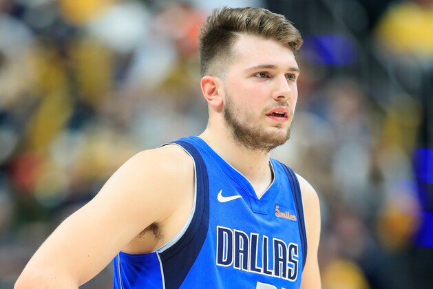 INDIANAPOLIS, IN - JANUARY 19:  Luka Doncic #77 of the Dallas Mavericks watches the action against the  Indiana Pacers at Bankers Life Fieldhouse on January 19, 2019 in Indianapolis, Indiana.   NOTE TO USER: User expressly acknowledges and agrees that, by downloading and or using this photograph, User is consenting to the terms and conditions of the Getty Images License Agreement.  (Photo by Andy Lyons/Getty Images)