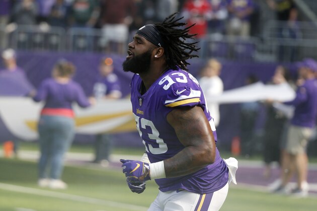 Minnesota Vikings defensive tackle Sheldon Richardson runs onto the field before an NFL football game against the Buffalo Bills, Sunday, Sept. 23, 2018, in Minneapolis. (AP Photo/Bruce Kluckhohn)