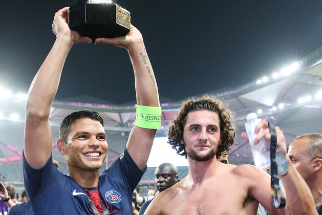 SHENZHEN, CHINA - AUGUST 04:  Thiago Emiliano da Silva, Adrien Rabiot of Paris Saint Germain celebrates the champion after the match between Paris Saint Germain and Monaco at Shenzhen Longgang Sports Center on August 4, 2018 in Shenzhen, China.  (Photo by Zhizhao Wu/Getty Images)