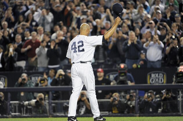 New York Yankees pitcher Mariano Rivera reacts to the fans during the ninth inning of a baseball game against the Tampa Bay Rays Thursday, Sept. 26, 2013, at Yankee Stadium in New York. It was Rivera's last home game before his retirement. (AP Photo/Bill Kostroun)