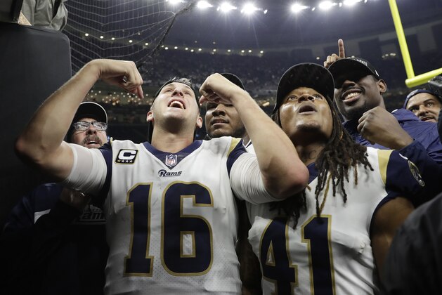 Los Angeles Rams quarterback Jared Goff (16) and Los Angeles Rams defensive back Marqui Christian leave the field after overtime of the NFL football NFC championship game against the New Orleans Saints, Sunday, Jan. 20, 2019, in New Orleans. The Rams won 26-23. (AP Photo/Carolyn Kaster)