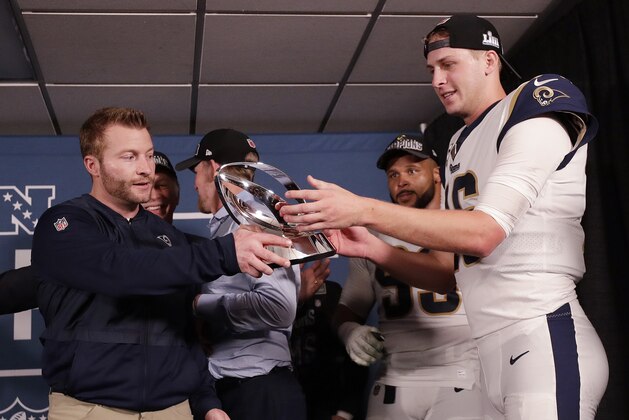 Los Angeles Rams head coach Sean McVay and Los Angeles Rams quarterback Jared Goff hold the NFC Championship trophy after overtime of the NFL football NFC championship game against the New Orleans Saints, Sunday, Jan. 20, 2019, in New Orleans. The Rams won 26-23. (AP Photo/David J. Phillip)