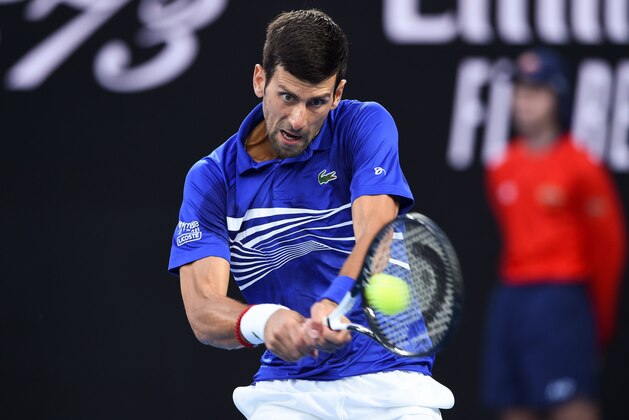 Serbia's Novak Djokovic hits a return against Japan's Kei Nishikori during their men's singles quarter-final match on day ten of the Australian Open tennis tournament in Melbourne on January 23, 2019. (Photo by Greg Wood / AFP) / -- IMAGE RESTRICTED TO EDITORIAL USE - STRICTLY NO COMMERCIAL USE -- (Photo credit should read GREG WOOD/AFP/Getty Images) Serbia's Novak Djokovic hits a return against Japan's Kei Nishikori during their men's singles quarter-final match on day ten of the Australian Open tennis tournament in Melbourne on January 23, 2019. (Photo by Greg Wood / AFP) / -- IMAGE RESTRICTED TO EDITORIAL USE - STRICTLY NO COMMERCIAL USE -- (Photo credit should read GREG WOOD/AFP/Getty Images)