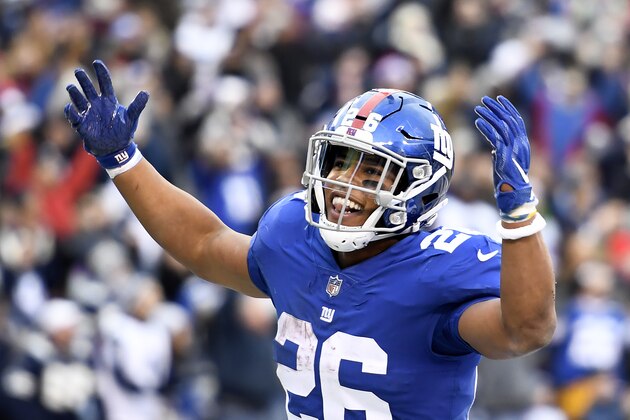 EAST RUTHERFORD, NEW JERSEY - DECEMBER 30: Saquon Barkley #26 of the New York Giants reacts after scoring during the fourth quarter of the game against the Dallas Cowboys at MetLife Stadium on December 30, 2018 in East Rutherford, New Jersey. (Photo by Sarah Stier/Getty Images)