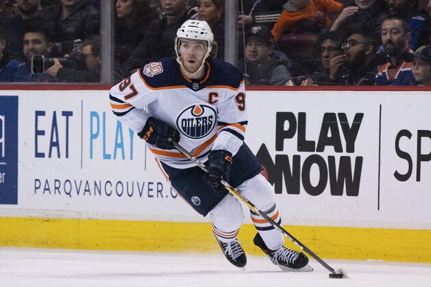 VANCOUVER, BC - JANUARY 16: Connor McDavid #97 of the Edmonton Oilers skates with the puck in NHL action against the Vancouver Canucks on January, 16, 2019 at Rogers Arena in Vancouver, British Columbia, Canada.  (Photo by Rich Lam/Getty Images)