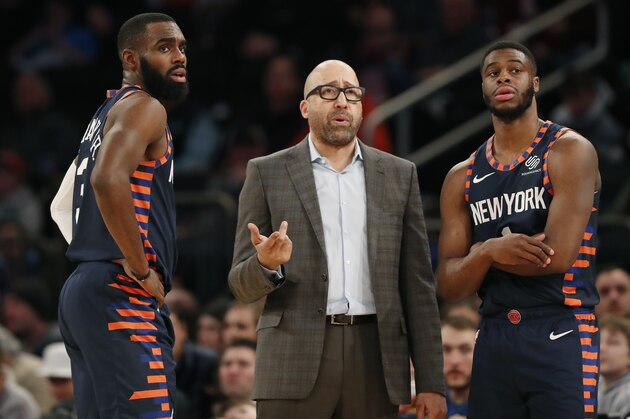 New York Knicks guard Tim Hardaway Jr. (3) and Knicks guard Emmanuel Mudiay talk to Knicks head coach David Fizdale during a timeout in the second half of an NBA basketball game, Monday, Jan. 21, 2019 in New York. The Thunder defeated the Knicks 127-109. (AP Photo/Kathy Willens)