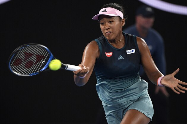 Japan's Naomi Osaka makes a forehand return to Karolina Pliskova of the Czech Republic during their semifinal at the Australian Open tennis championships in Melbourne, Australia, Thursday, Jan. 24, 2019. (AP Photo/Andy Brownbill)