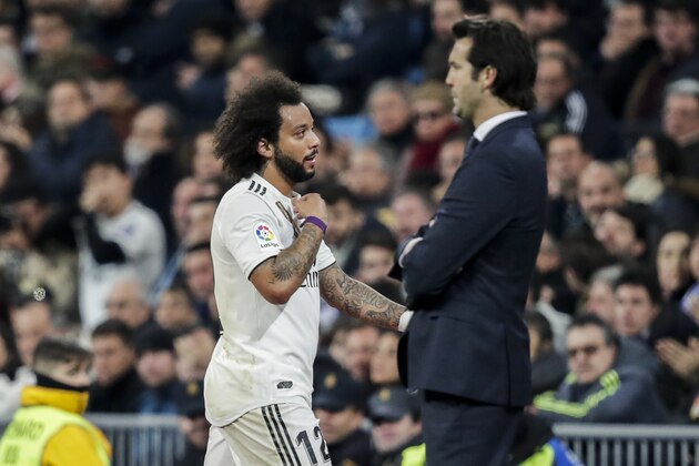 MADRID, SPAIN - JANUARY 6: (L-R) Marcelo of Real Madrid, coach Santiago Solari of Real Madrid during the La Liga Santander  match between Real Madrid v Real Sociedad at the Santiago Bernabeu on January 6, 2019 in Madrid Spain (Photo by David S. Bustamante/Soccrates/Getty Images)